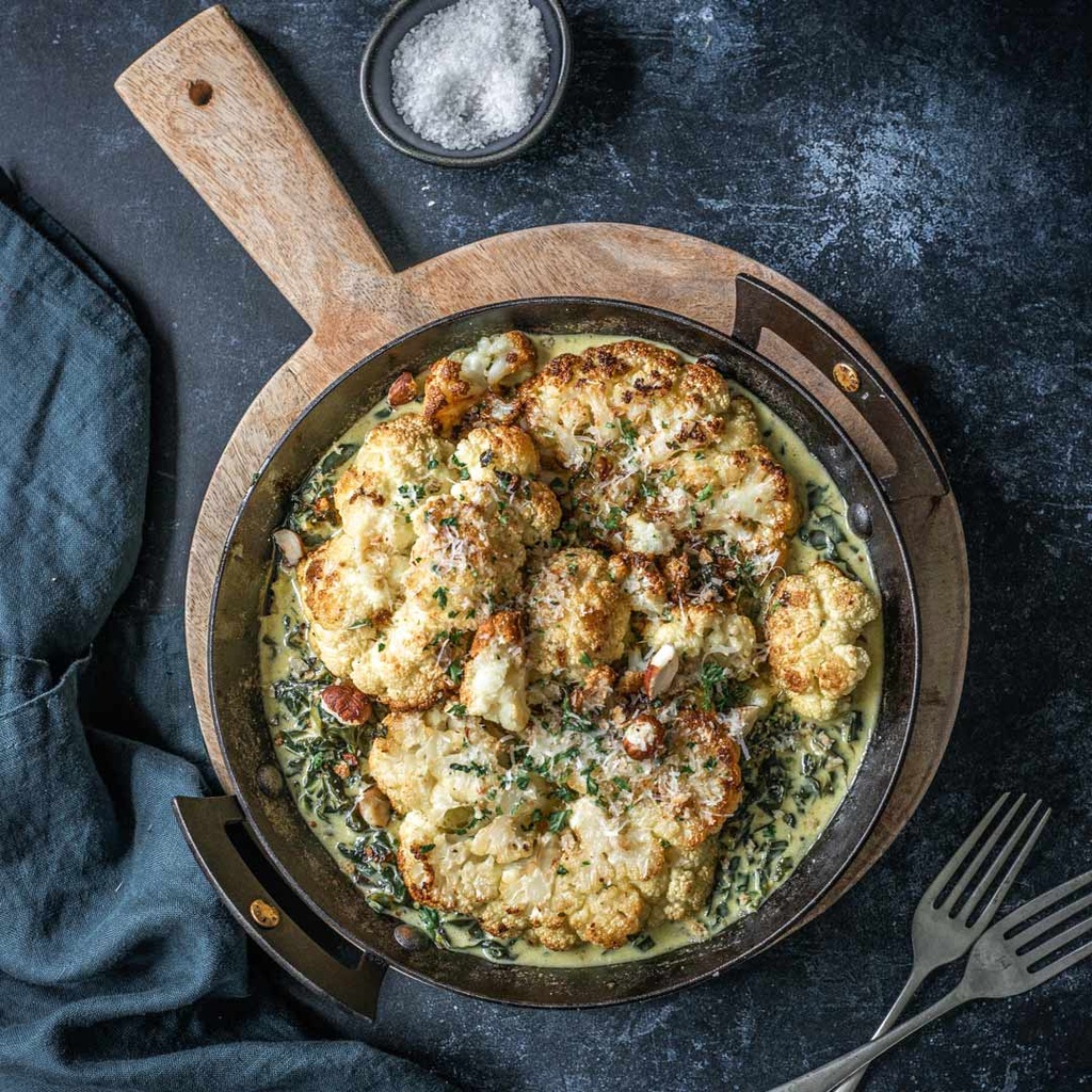 Roasted cauliflower with creamed greens and herby hazelnut crumb